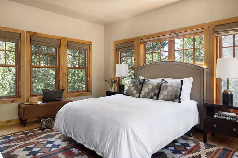 Bright bedroom with large windows.