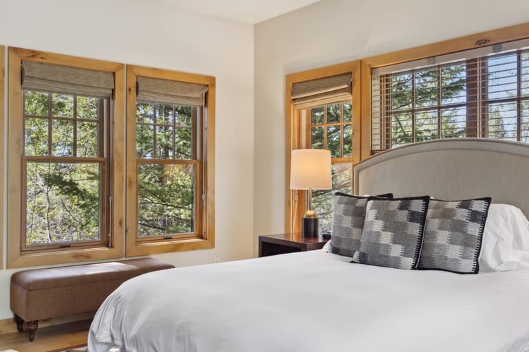 Cozy bedroom with wooden windows.