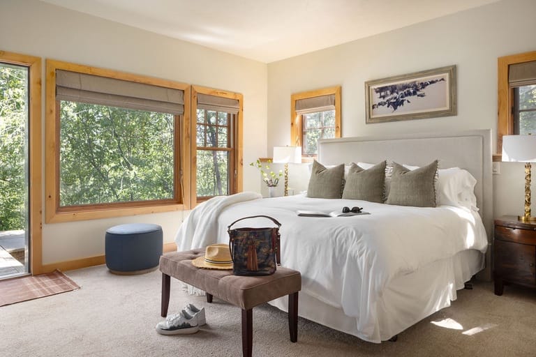 Bright bedroom with large windows.