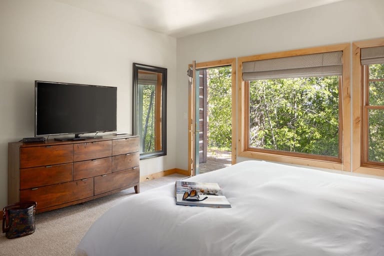 Bright bedroom with large window.