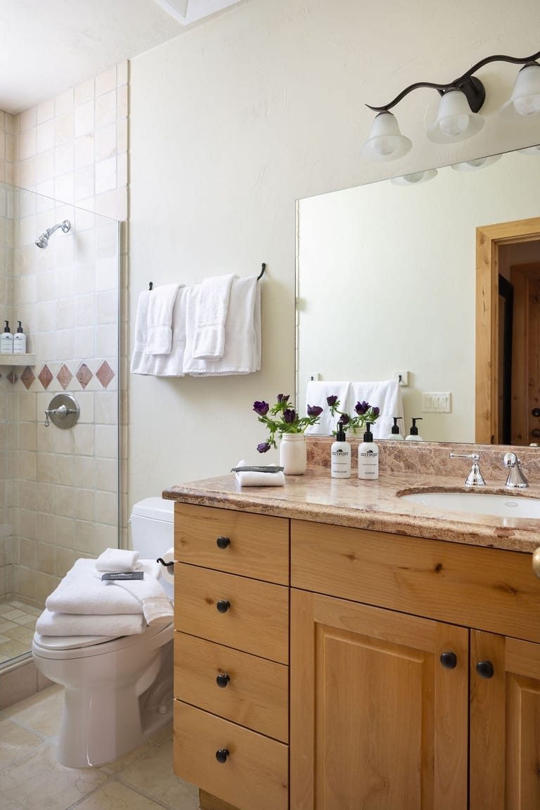 Modern bathroom with wooden vanity.