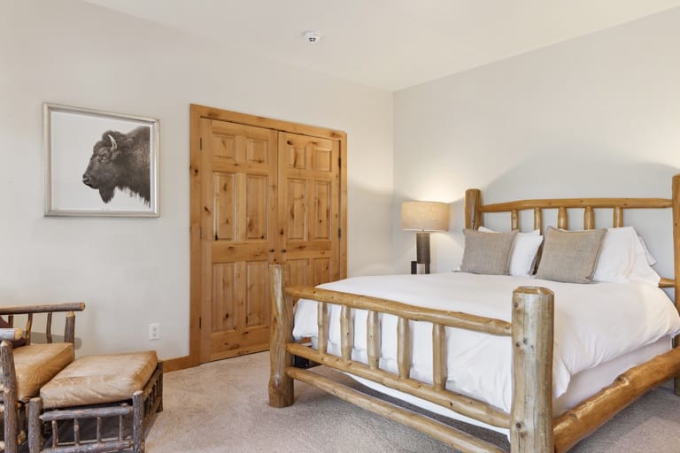 Rustic bedroom with wooden bed.