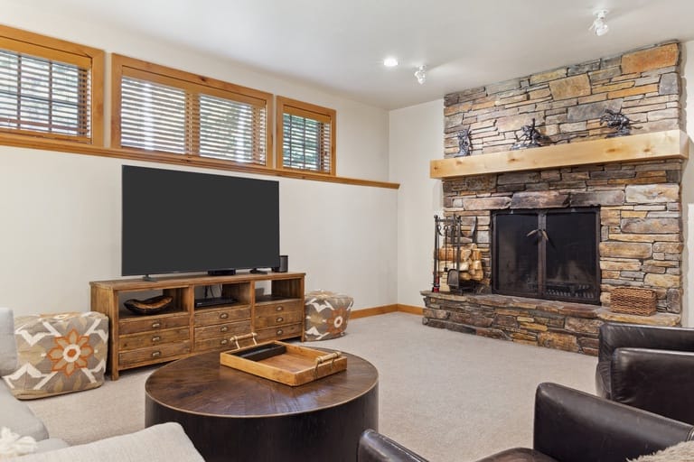 Cozy living room with stone fireplace.