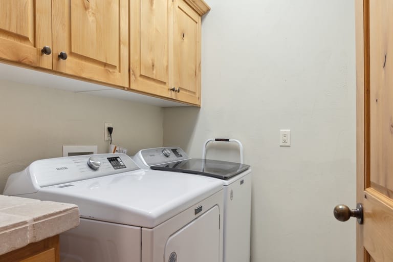 Laundry room with washer, dryer.