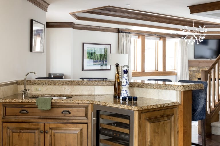 Kitchen with wooden cabinets and countertop.