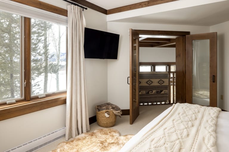 Cozy bedroom with large window.
