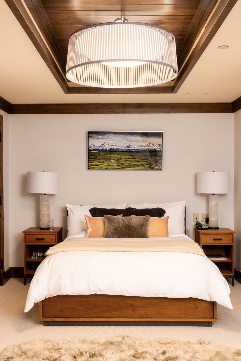 Cozy bedroom with modern lighting.