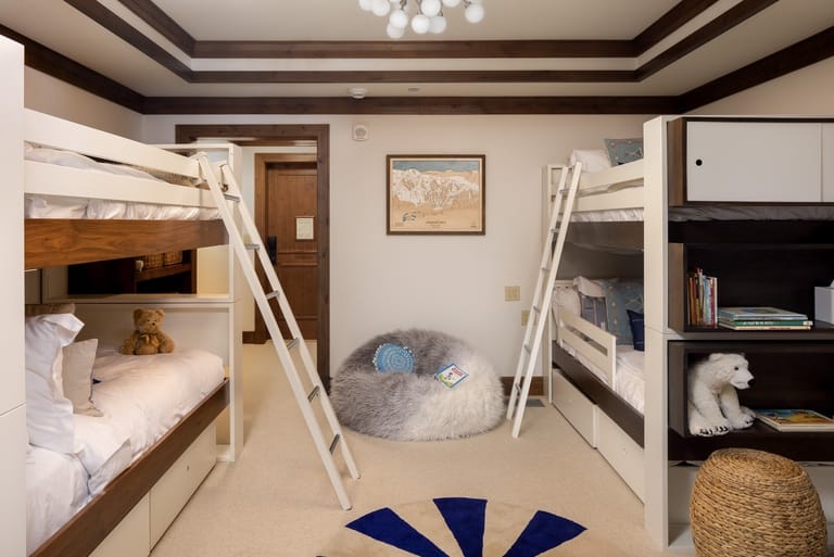 Two bunk beds in cozy room.