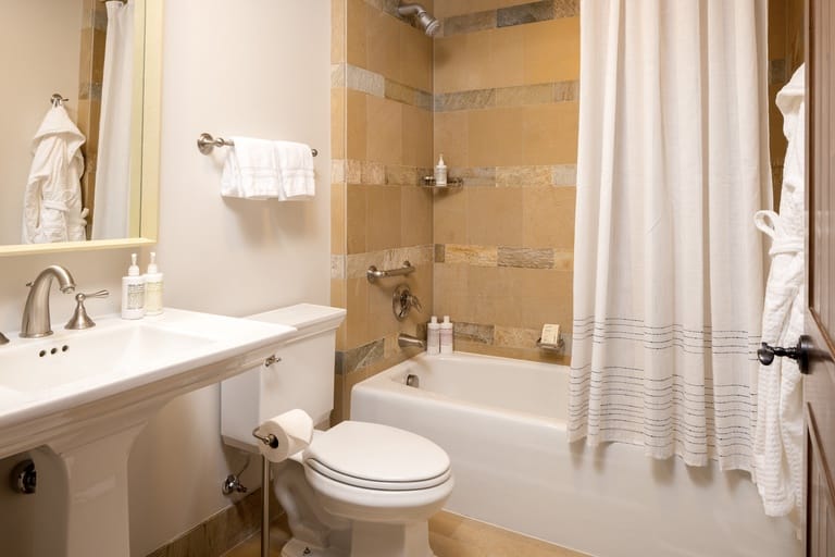 Modern bathroom with tub and sink.