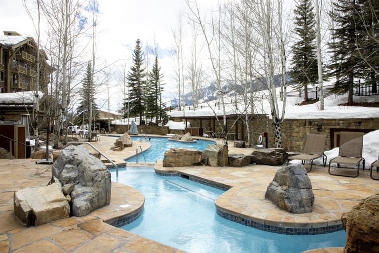 Winter resort pool with snow.