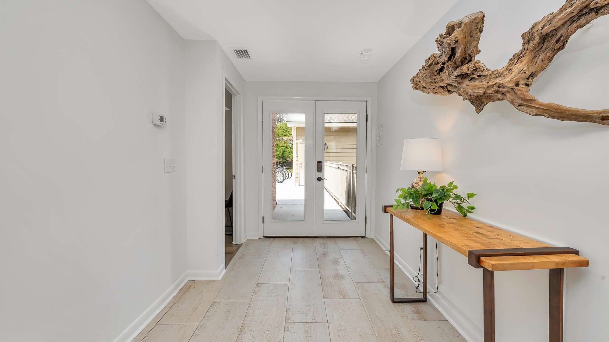 Hallway with table and decor.
