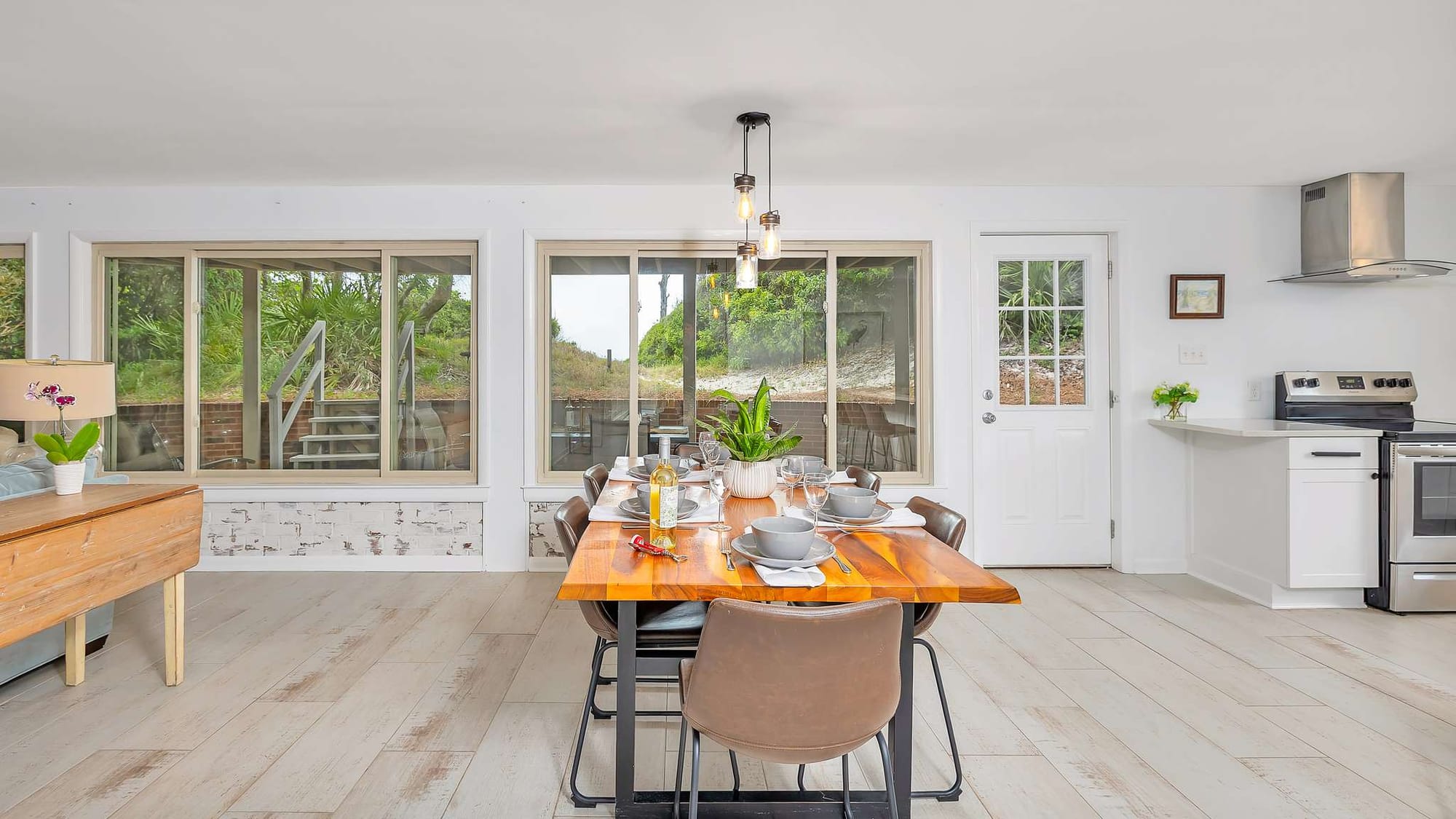 Modern dining room with large windows.
