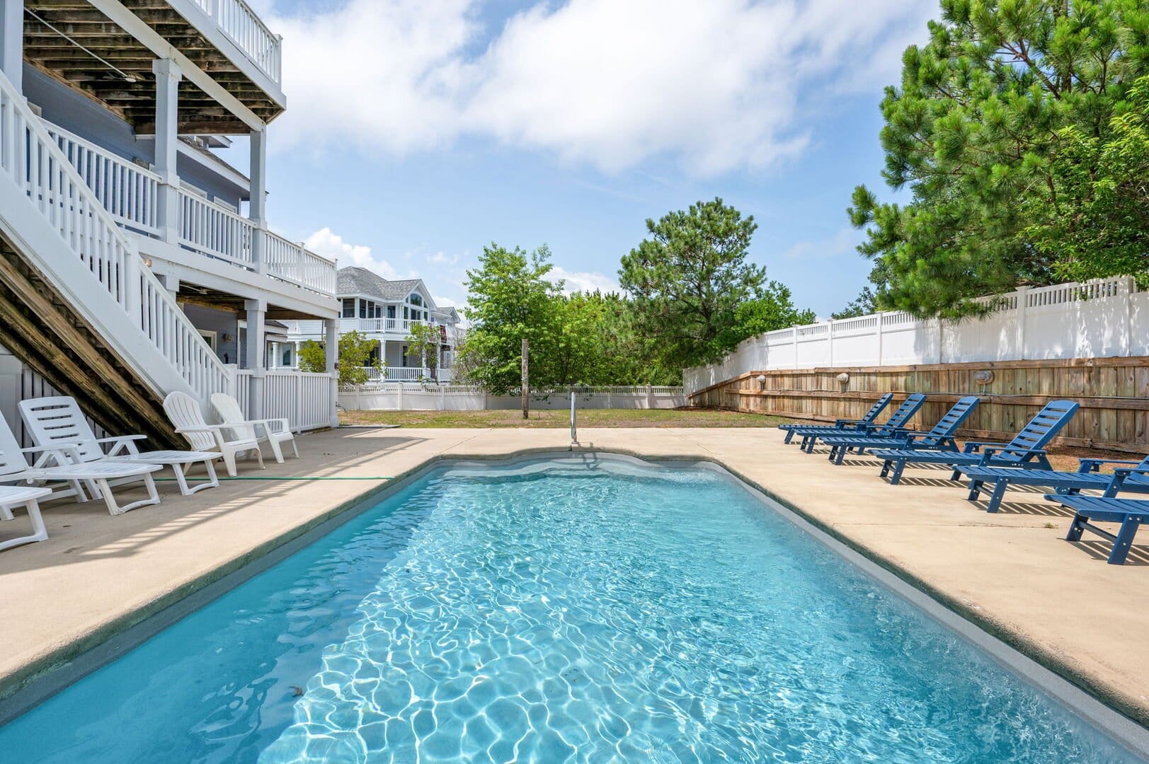 Outdoor pool with lounge chairs.