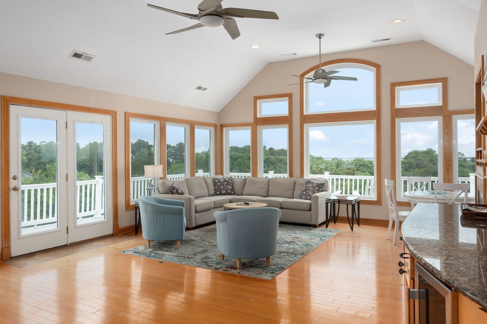 Spacious living room with large windows.
