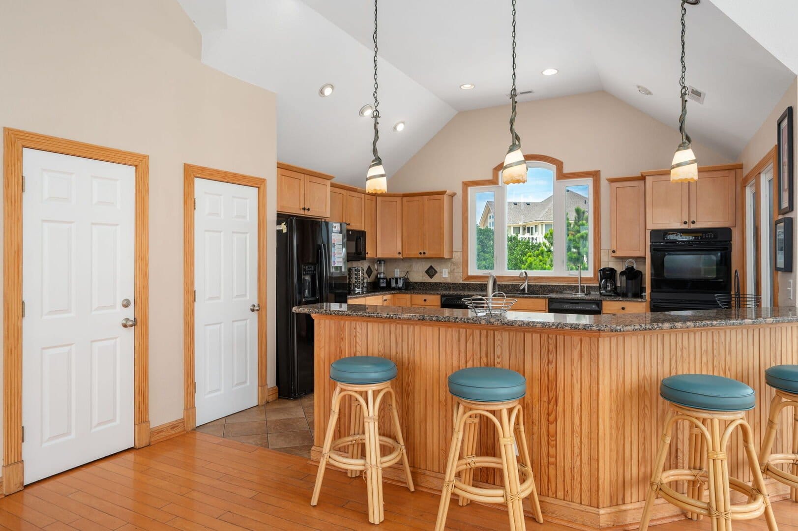 Spacious kitchen with bar seating.