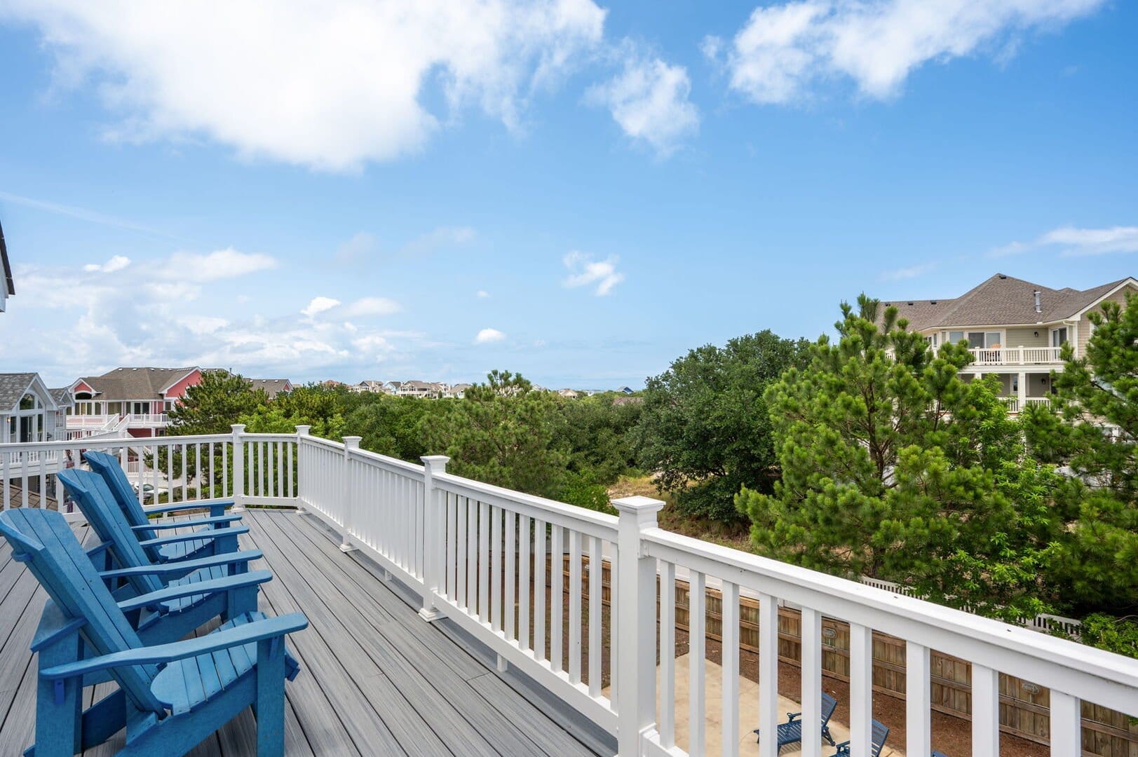 Deck with blue chairs, view.