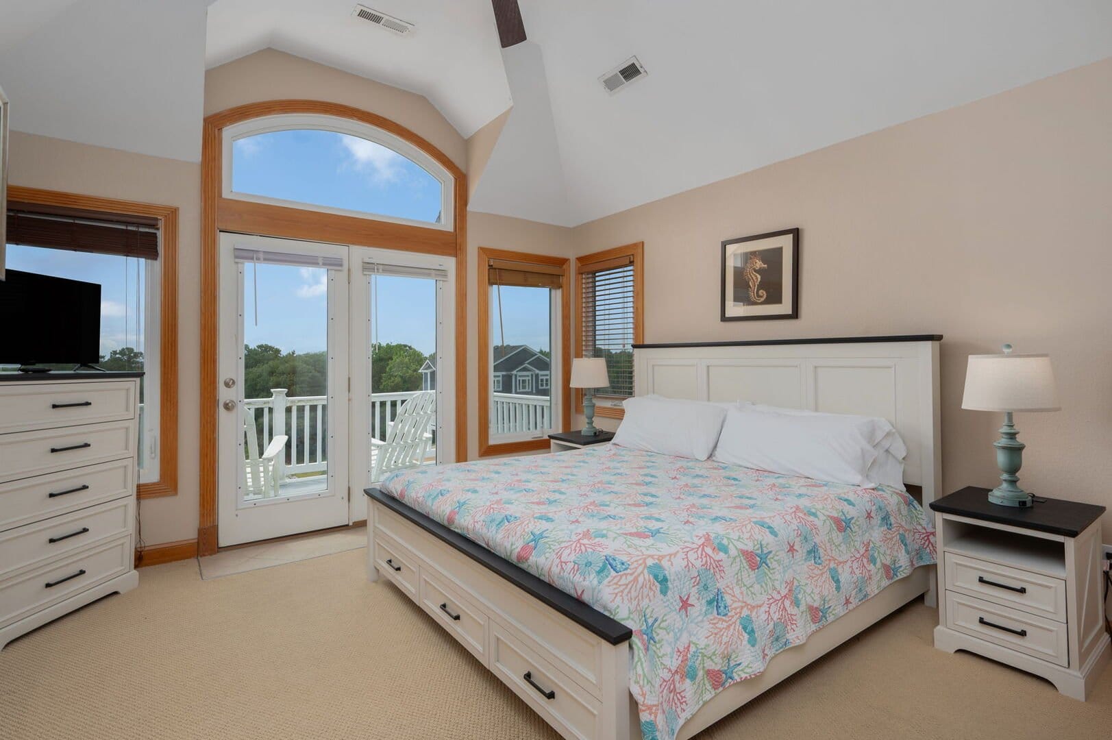 Bright bedroom with balcony view.