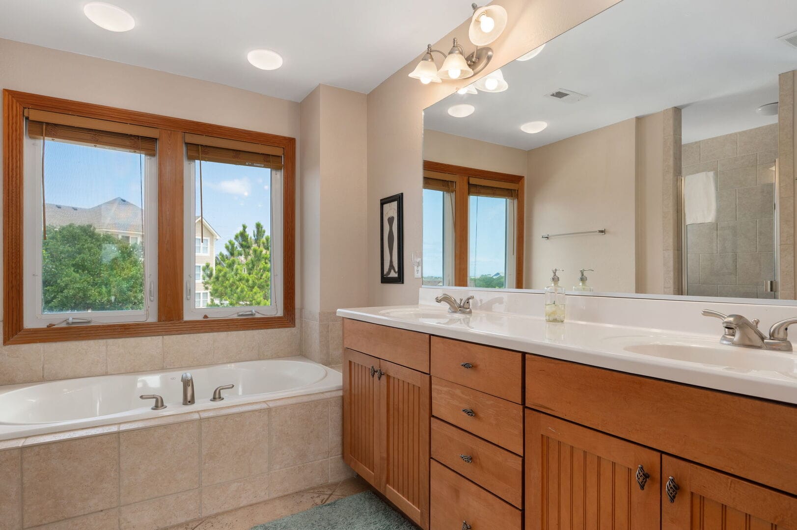 Bathroom with bathtub and vanity.
