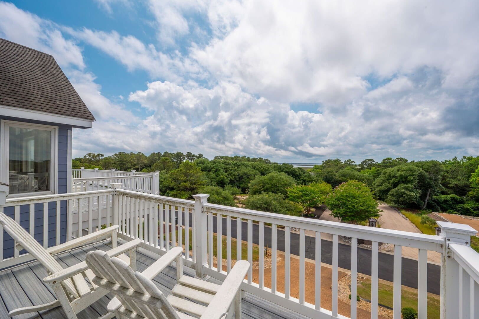 Balcony with chairs, scenic view.