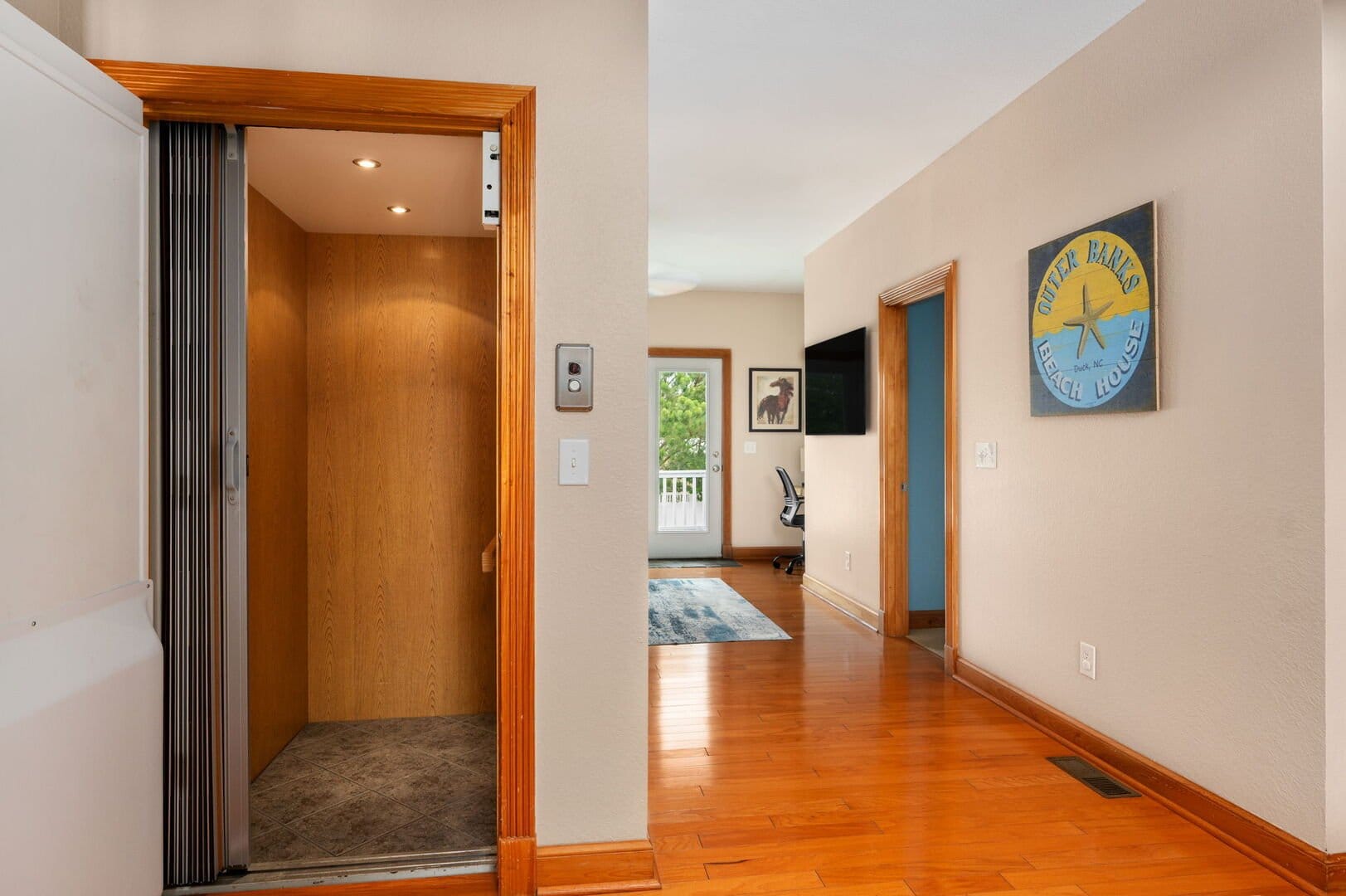Home elevator open in hallway.