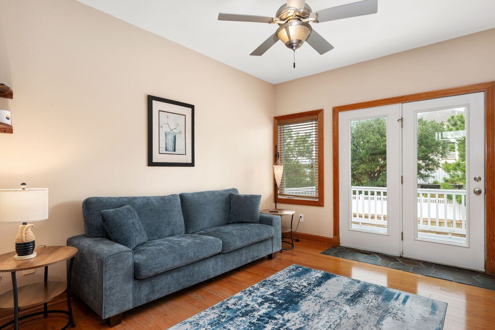 Cozy living room with blue sofa.