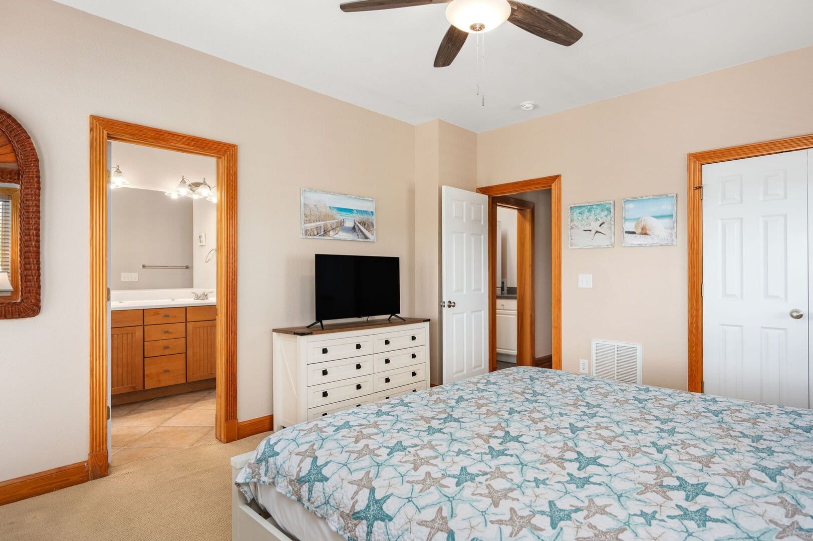 Bedroom with starfish-patterned bedspread.