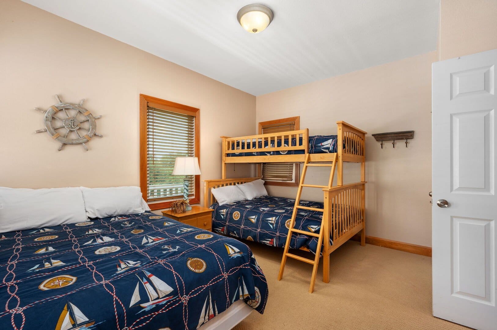 Bedroom with nautical-themed bunk beds.