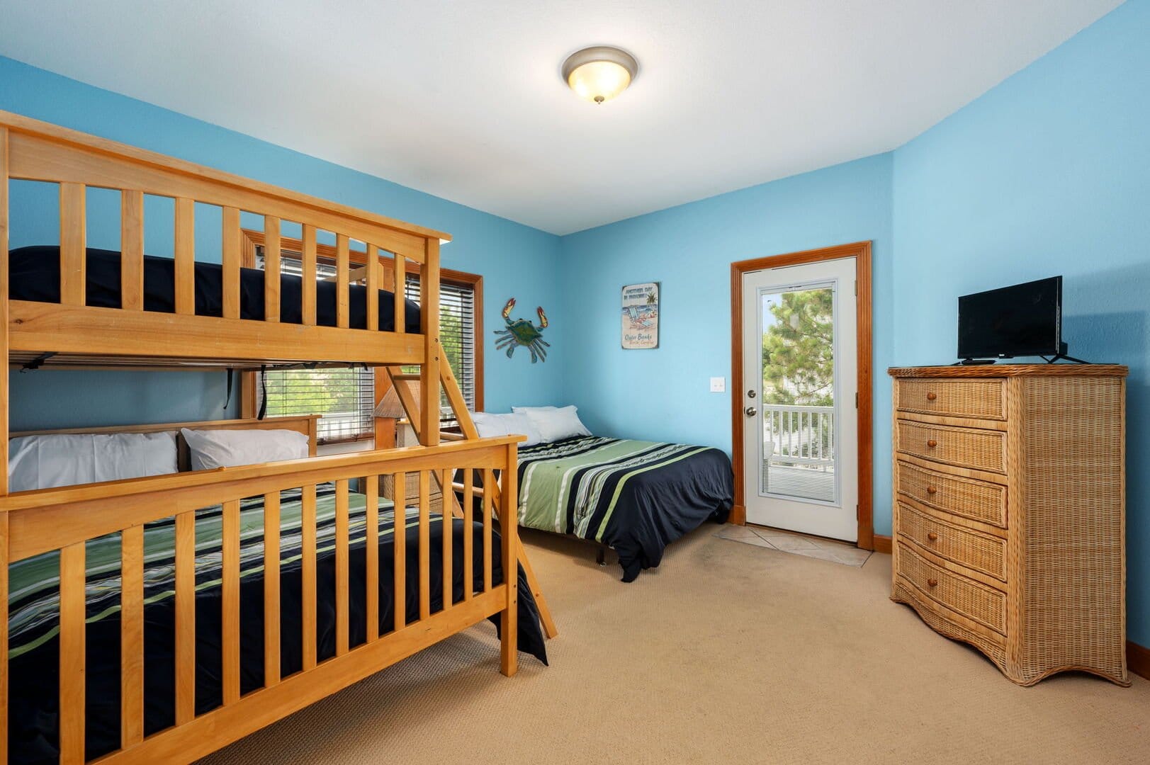 Bedroom with bunk and single beds.