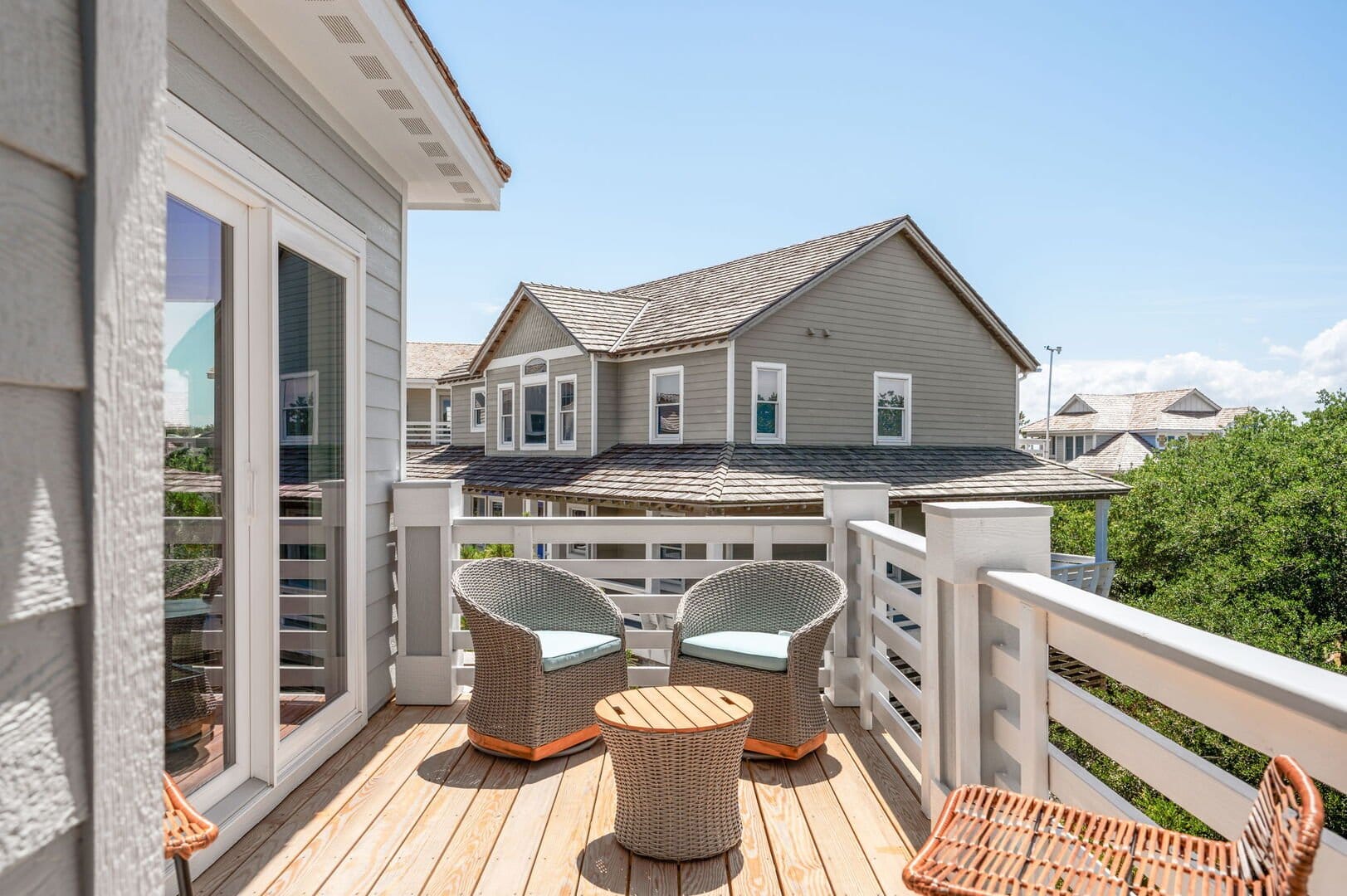 Sunny balcony with wicker furniture.