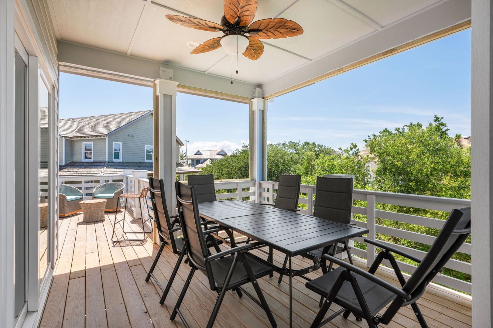 Outdoor patio with table and chairs.