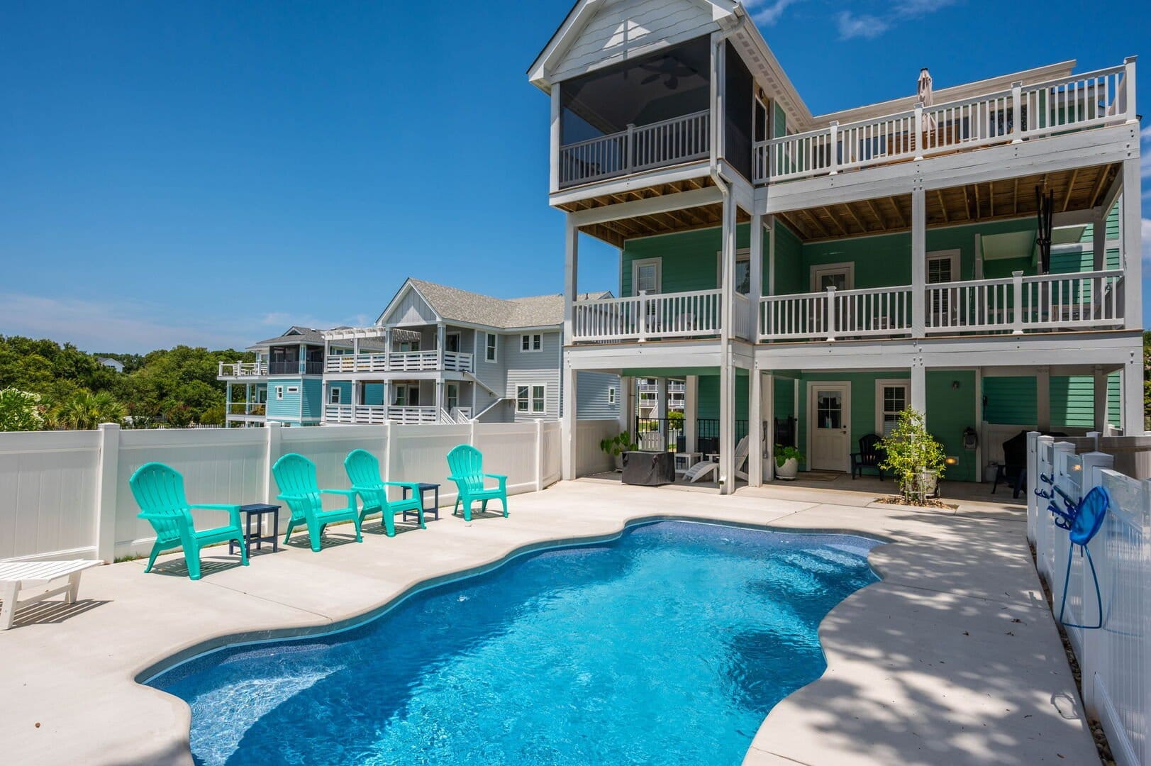 Three-story house with swimming pool.