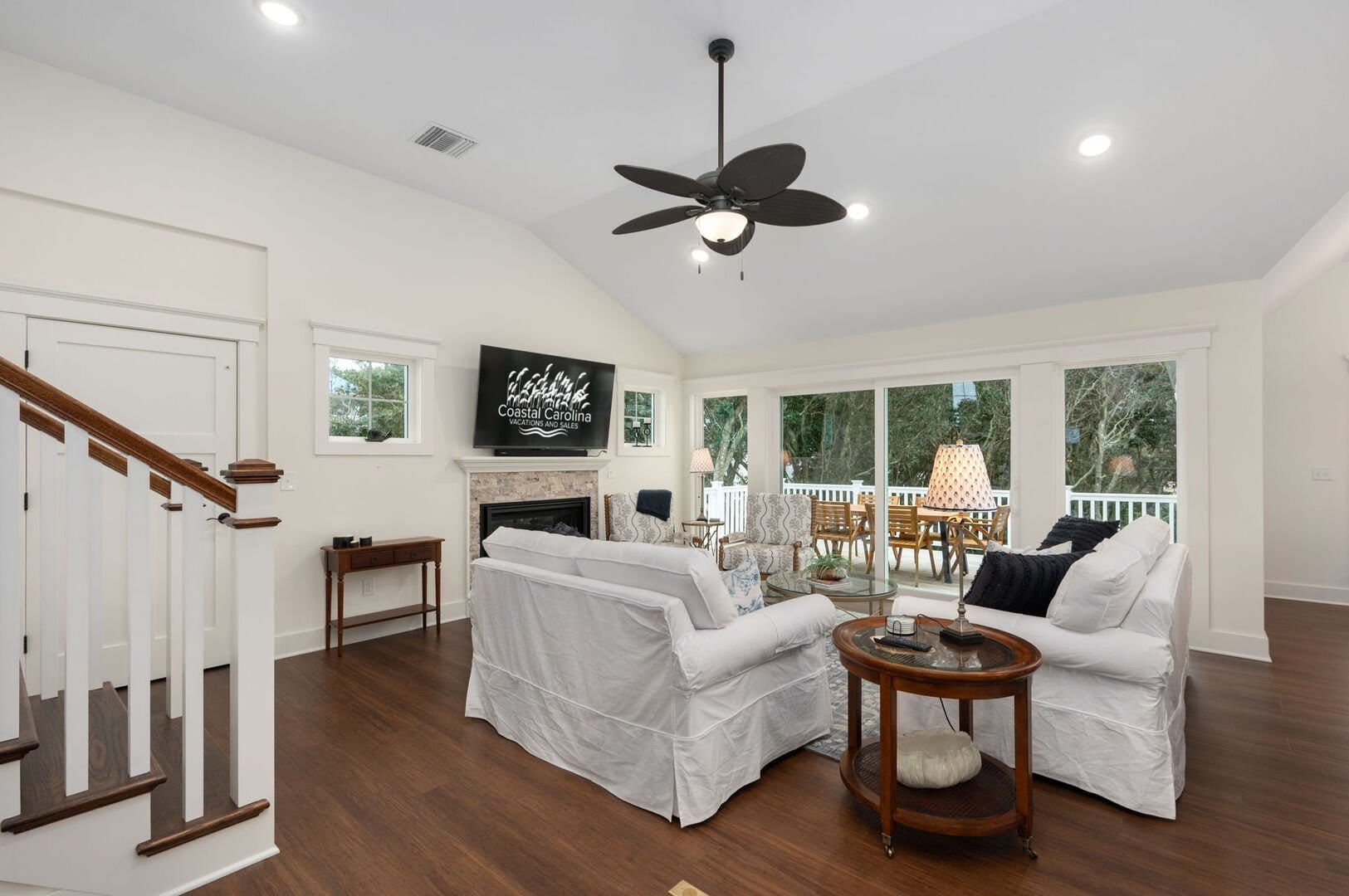 Living room with white sofas.