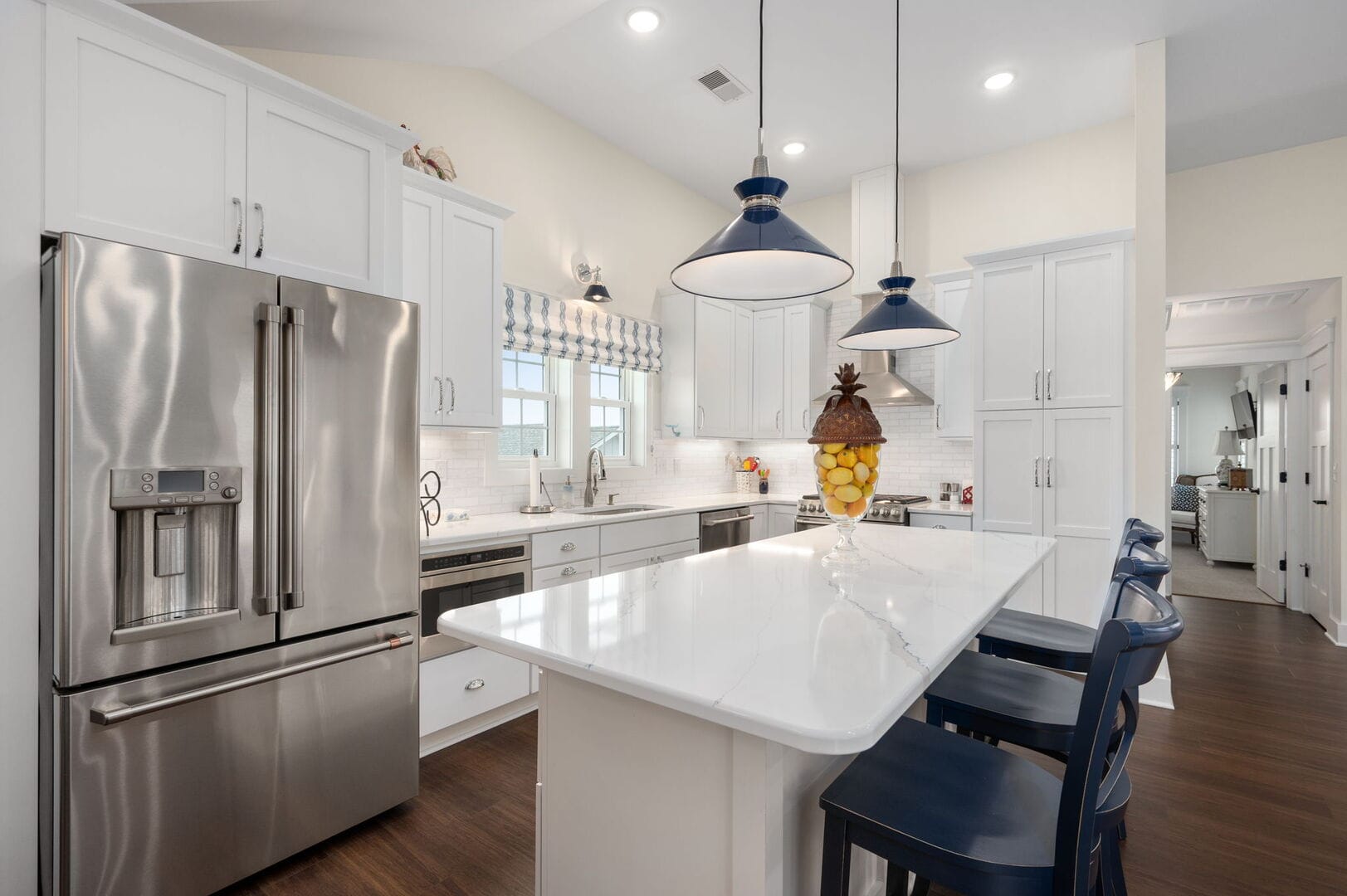 Modern kitchen with stainless steel appliances.