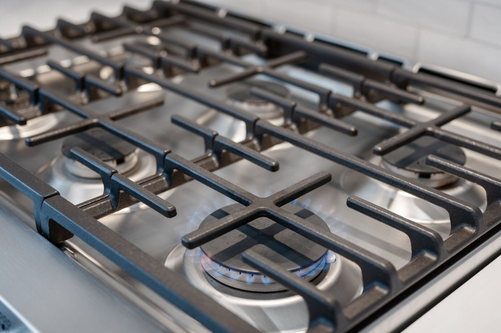 Gas stove with lit burners.