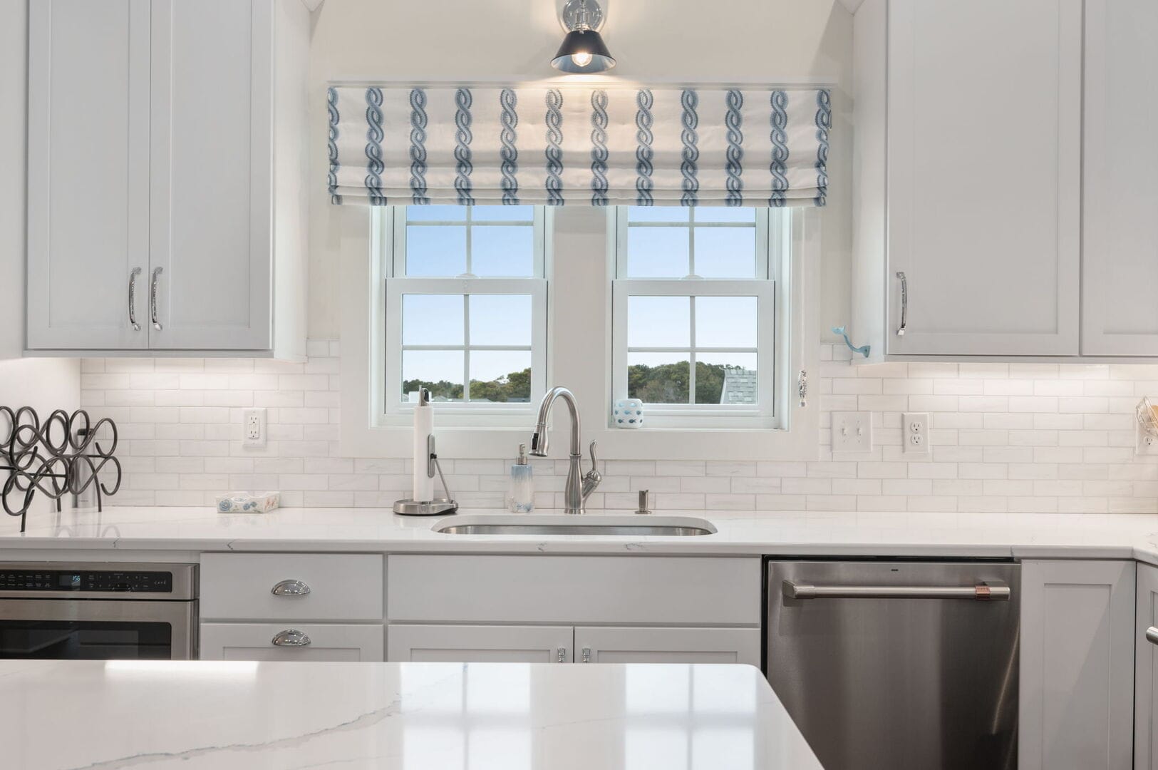 Bright kitchen with white cabinetry.
