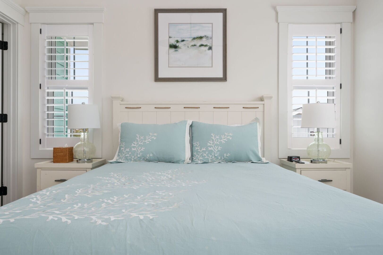 Bedroom with light blue bedding.
