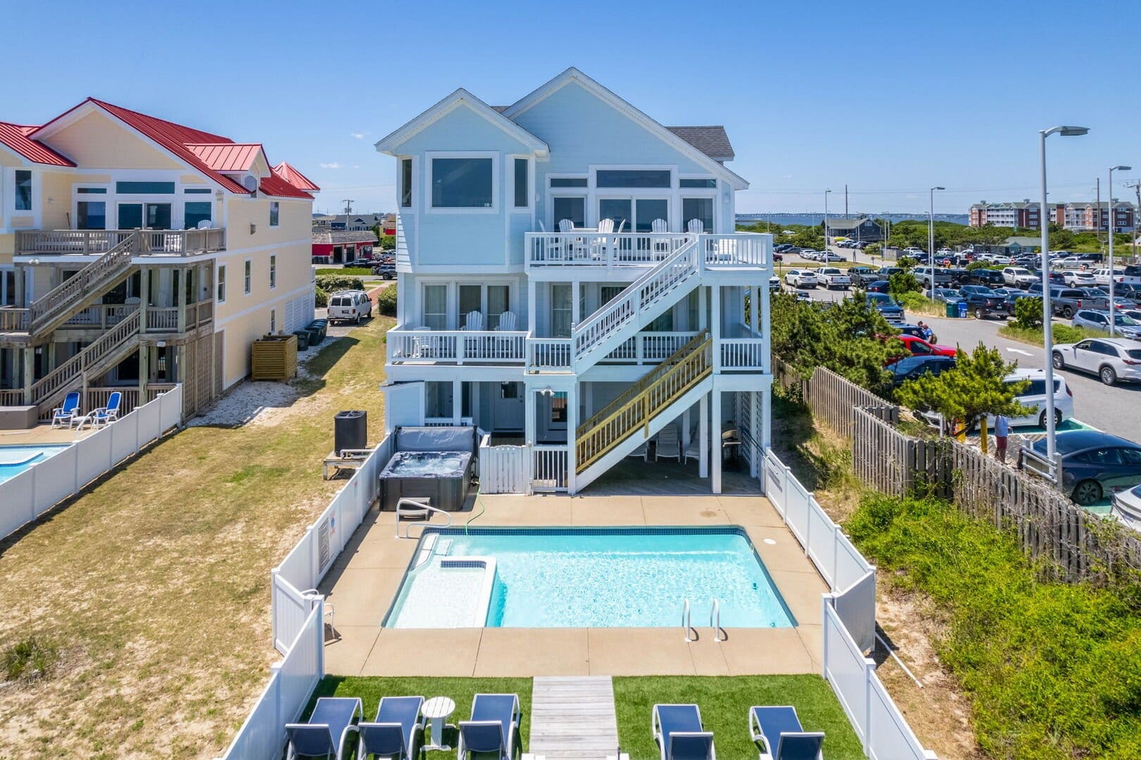 Beach house with pool and deck.