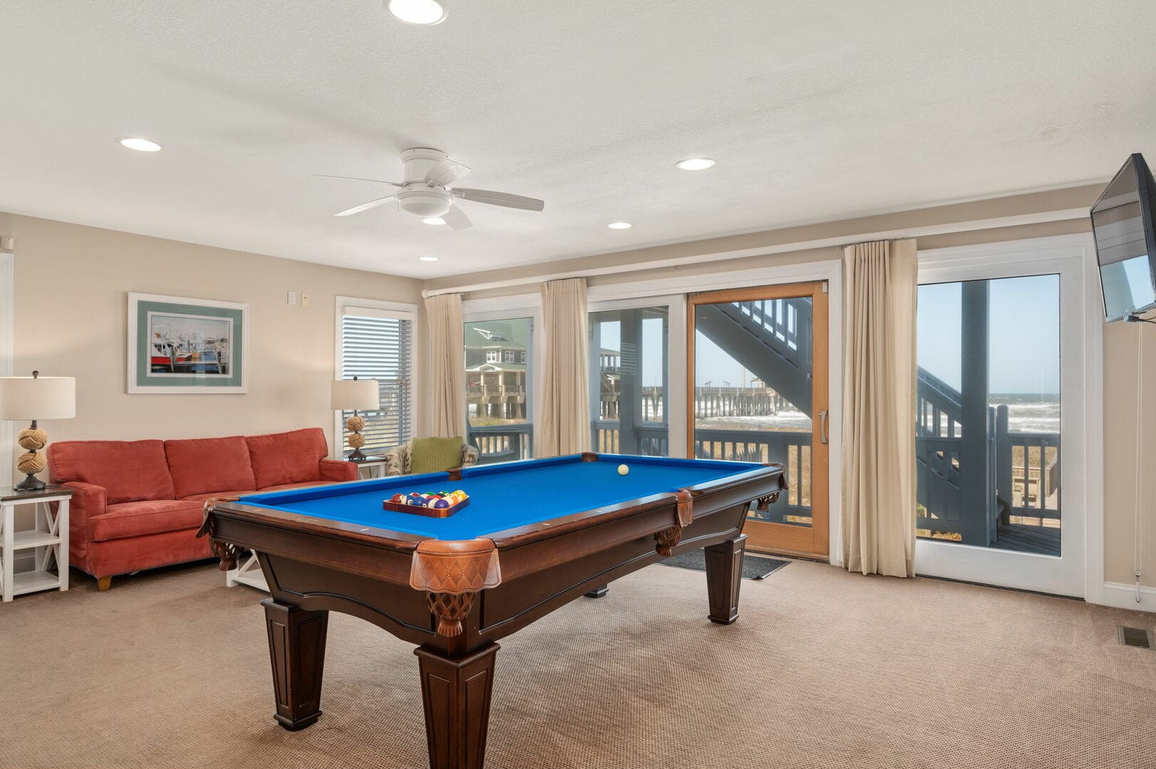 Room with pool table, ocean view.