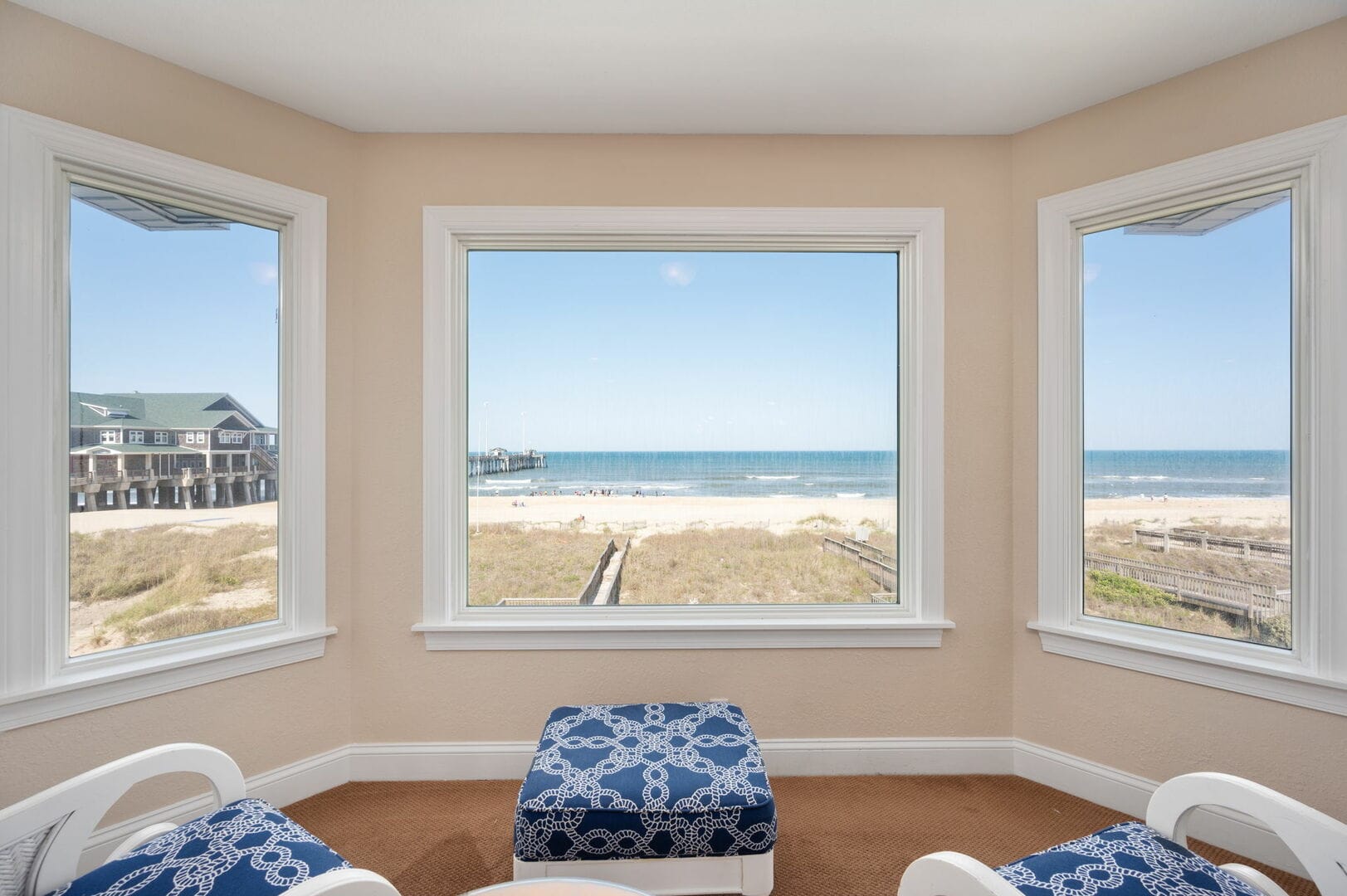 Room with beach view windows.