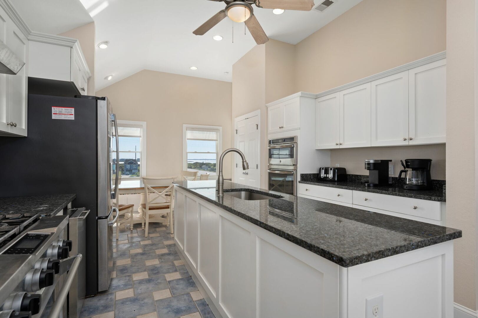 Modern kitchen with black countertops.