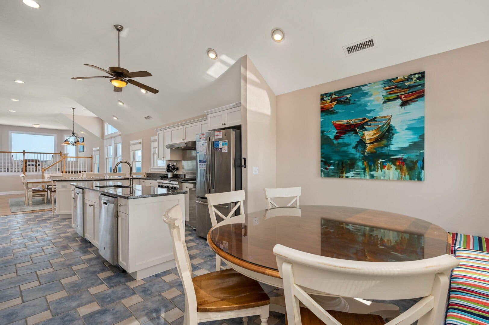 Modern kitchen with colorful painting.