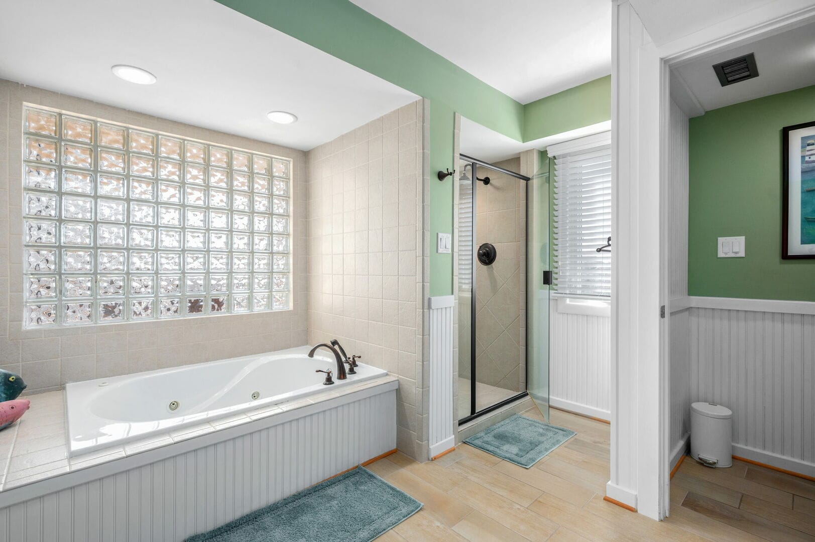 Modern bathroom with tub and shower.