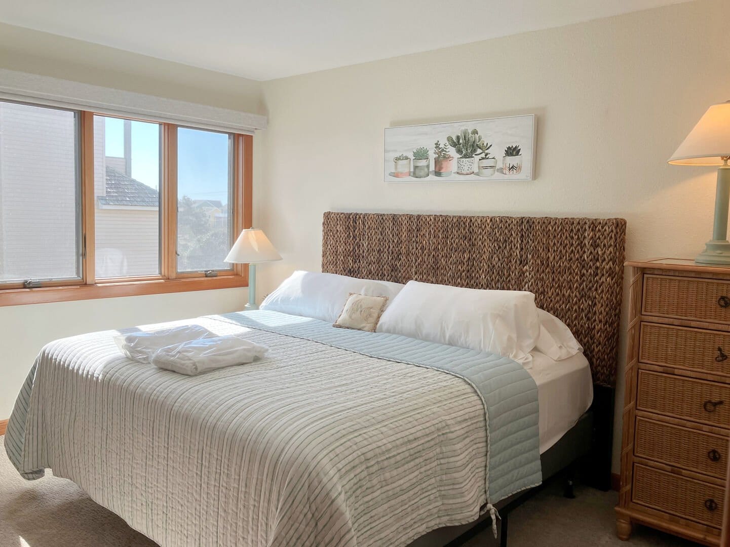 Cozy bedroom with large window.