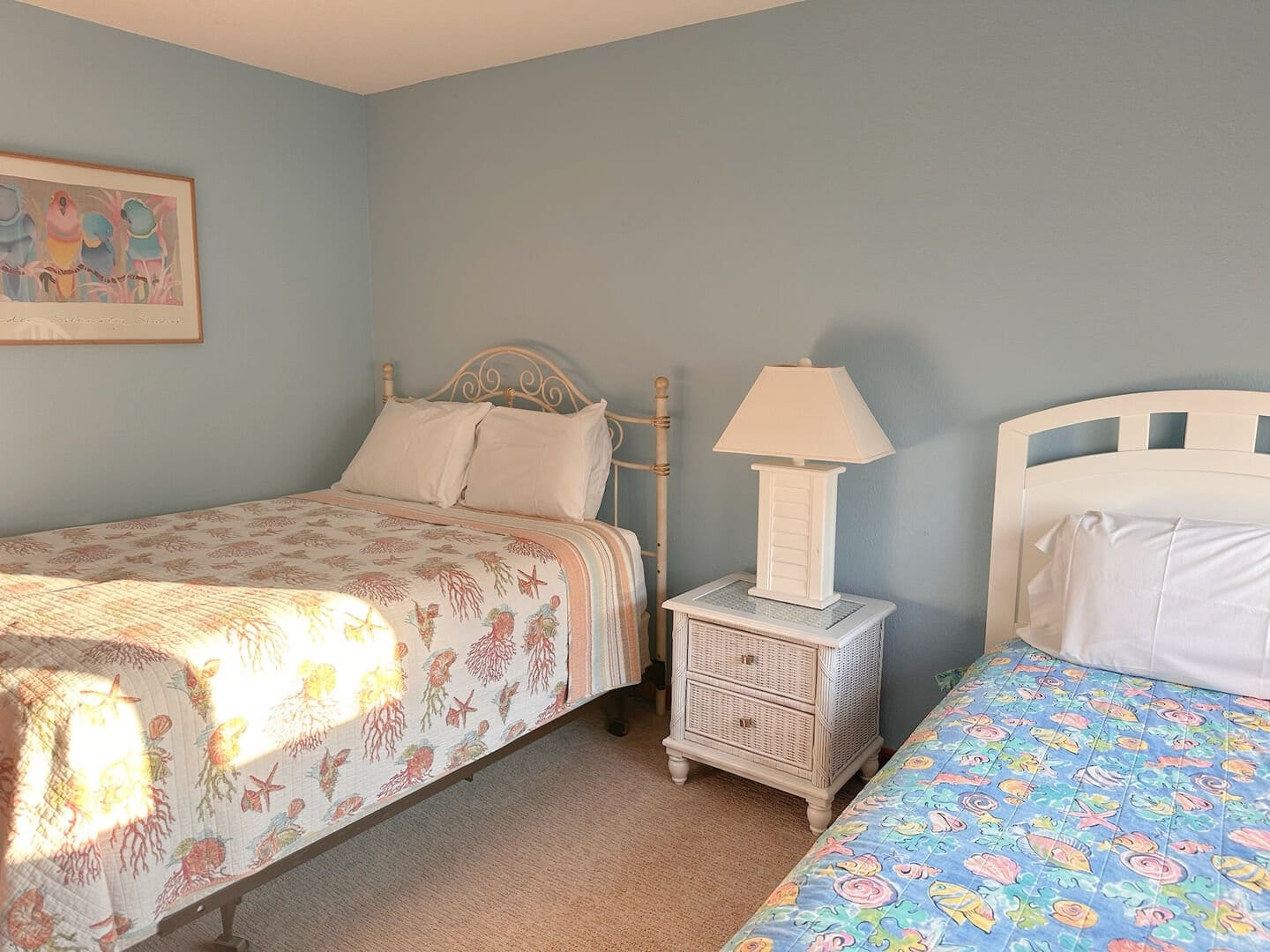 Two beds in a bedroom.