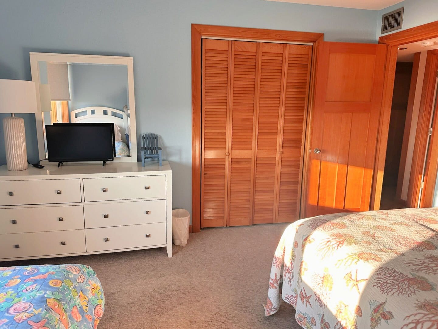 Bedroom with dresser and closet.