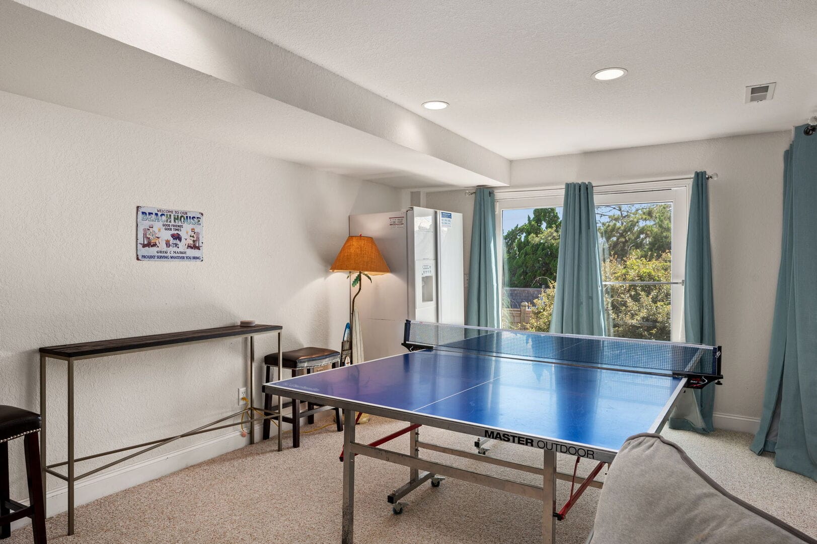 Ping pong table in bright room.
