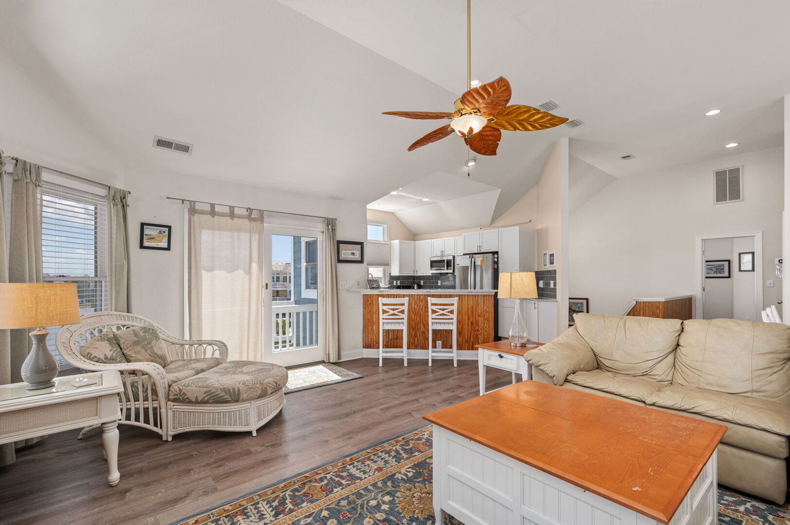 Bright living room with kitchen.
