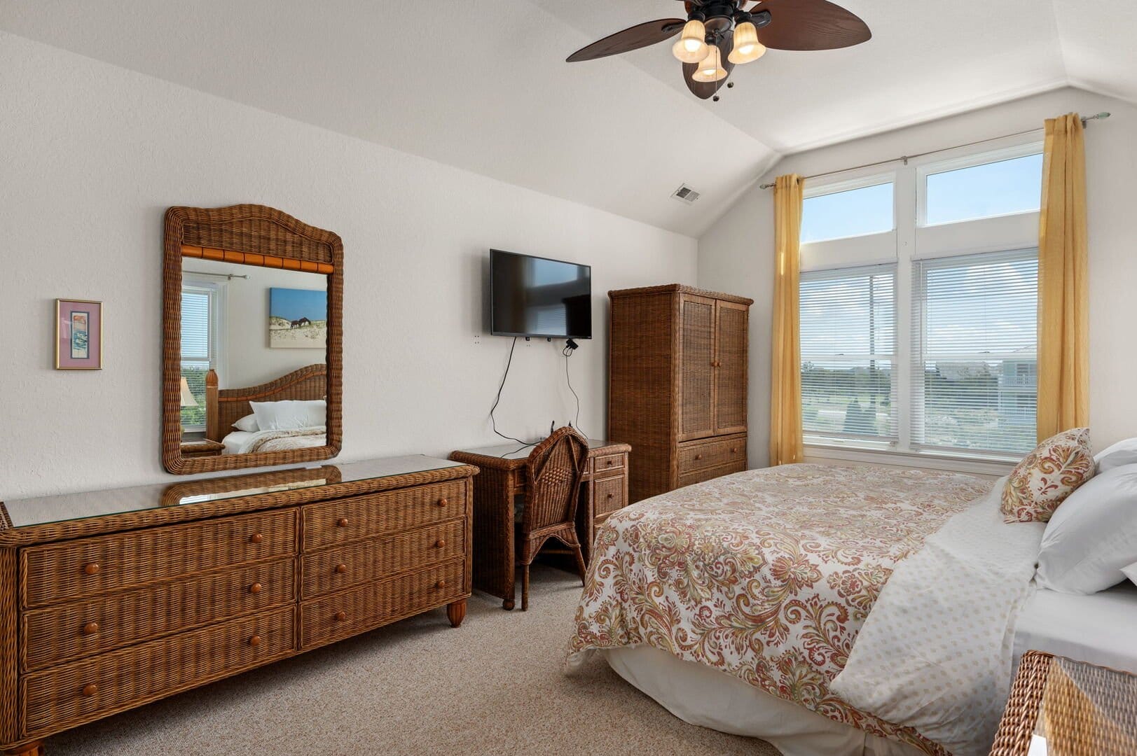 Cozy bedroom with wicker furniture.