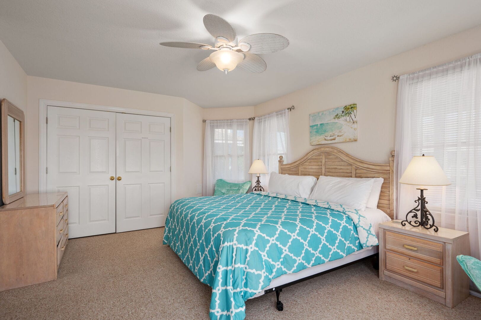Cozy bedroom with turquoise bedding.