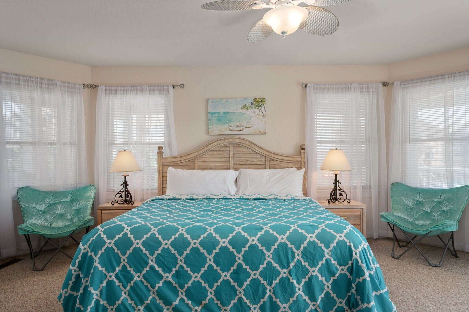 Cozy bedroom with blue bedding.